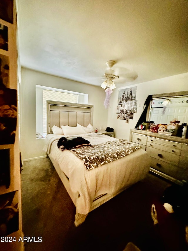 carpeted bedroom with ceiling fan