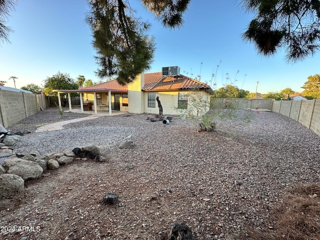 view of yard with cooling unit and a patio