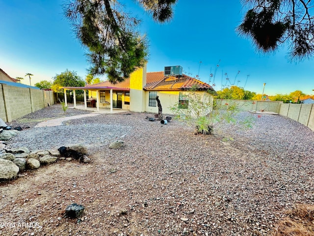 view of yard featuring central AC unit and a patio area