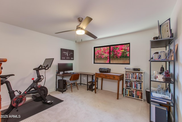 exercise area with a ceiling fan, carpet flooring, and baseboards