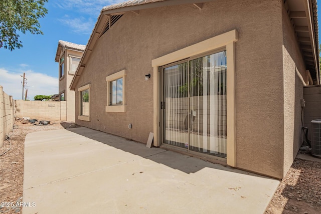 125 N 22nd Pl Unit 53, Mesa, AZ 85213 - view of exterior entry with stucco siding, a patio, and a tile roof