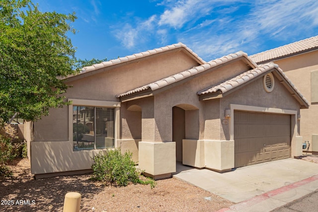 125 N 22nd Pl Unit 53, Mesa, AZ 85213 - view of front of property featuring an attached garage and stucco siding