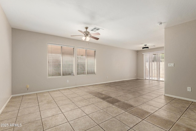 125 N 22nd Pl Unit 53, Mesa, AZ 85213 - spare room with light tile patterned flooring, a ceiling fan, and baseboards