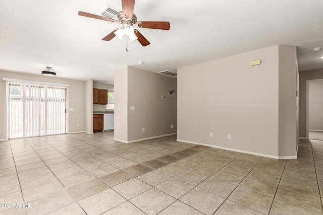 125 N 22nd Pl Unit 53, Mesa, AZ 85213 - unfurnished living room with a ceiling fan, light tile patterned flooring, and baseboards