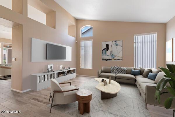 15032 N 54th Pl, Scottsdale, AZ 85254 - living area featuring light wood-style floors, baseboards, and high vaulted ceiling