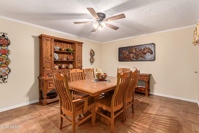 dining area with a textured ceiling and ornamental molding