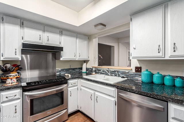 kitchen with appliances with stainless steel finishes, sink, and white cabinets