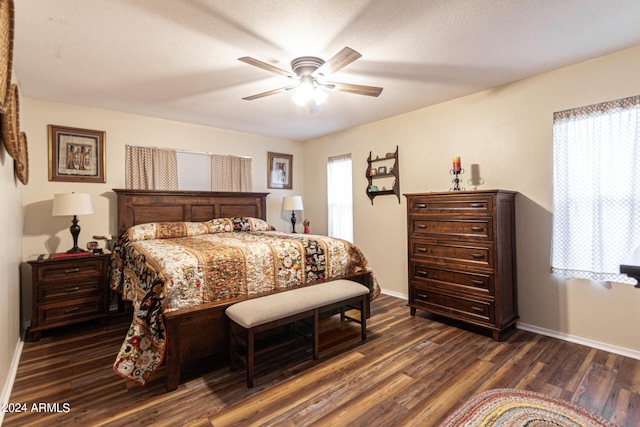 bedroom with ceiling fan and dark wood-type flooring