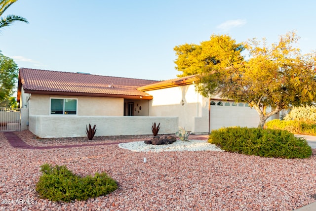 ranch-style house featuring a garage