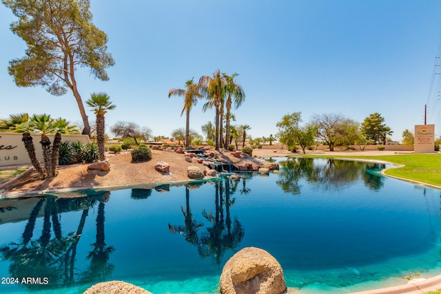 view of pool featuring a water view