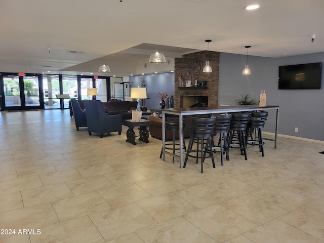 dining area featuring a stone fireplace