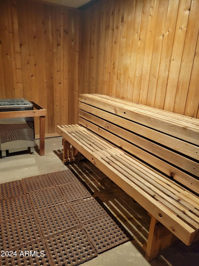 view of sauna featuring wooden walls