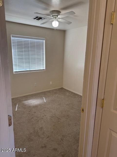 5122 E Shadow Ln, San Tan Valley, AZ 85140 - carpeted empty room featuring a ceiling fan and baseboards