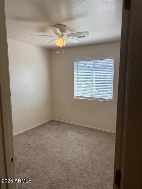 5122 E Shadow Ln, San Tan Valley, AZ 85140 - unfurnished room with carpet floors, baseboards, and ceiling fan