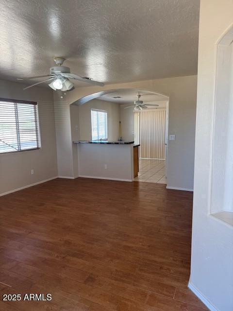 5122 E Shadow Ln, San Tan Valley, AZ 85140 - unfurnished room featuring ceiling fan, baseboards, plenty of natural light, and a textured ceiling