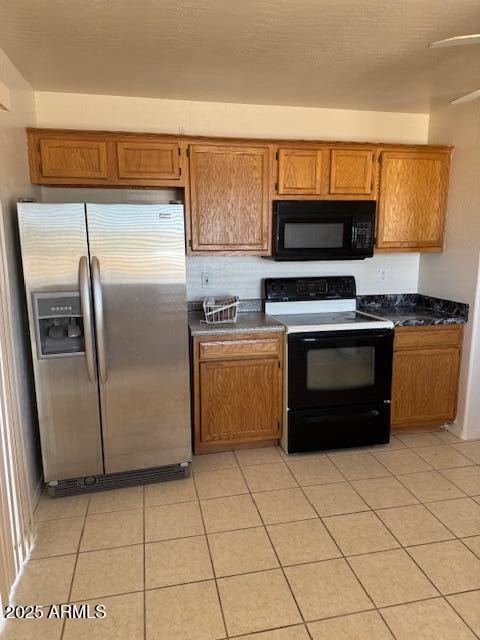 5122 E Shadow Ln, San Tan Valley, AZ 85140 - kitchen with black microwave, stainless steel refrigerator with ice dispenser, electric range oven, dark countertops, and brown cabinets