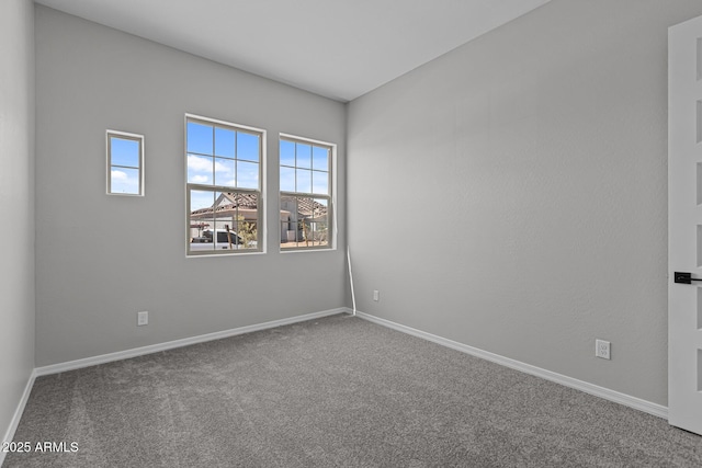 12332 W Parkway Ln, Avondale, AZ 85323 - empty room with carpet floors and baseboards