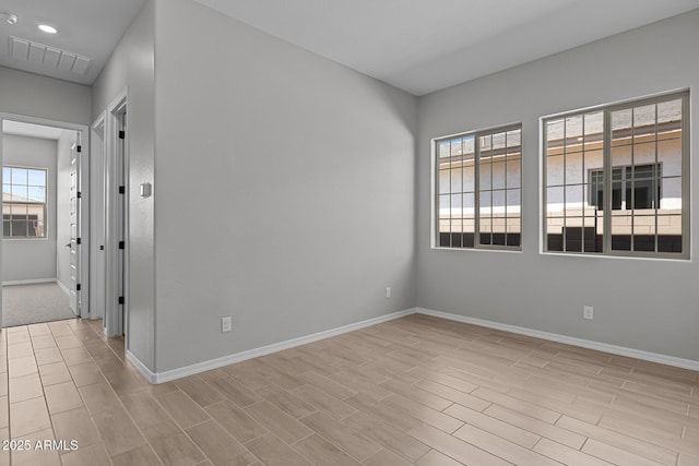 12332 W Parkway Ln, Avondale, AZ 85323 - spare room with baseboards and light wood-style floors