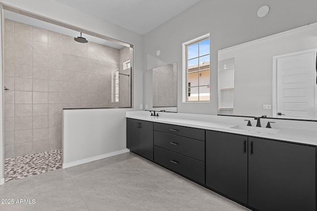 12332 W Parkway Ln, Avondale, AZ 85323 - full bath with double vanity, walk in shower, tile patterned floors, and baseboards