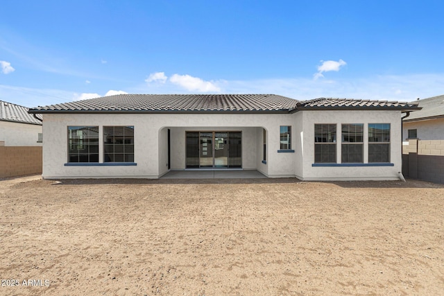 12332 W Parkway Ln, Avondale, AZ 85323 - rear view of property featuring a tile roof, a patio area, and stucco siding