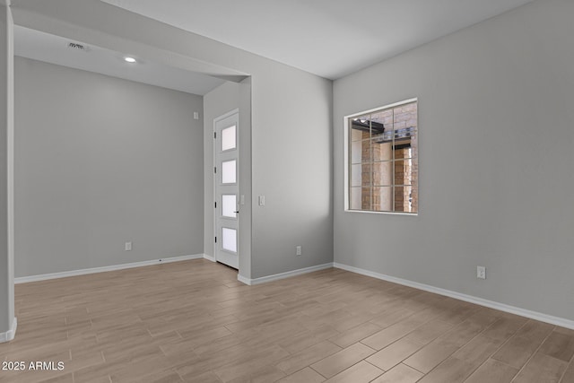 12332 W Parkway Ln, Avondale, AZ 85323 - spare room featuring light wood finished floors and baseboards