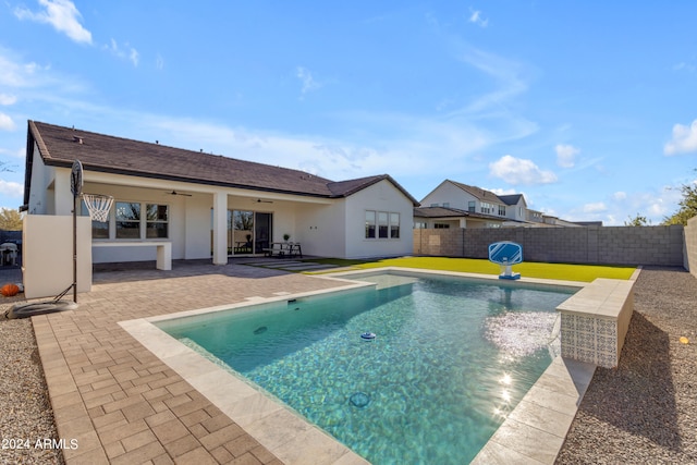 view of swimming pool with a patio area