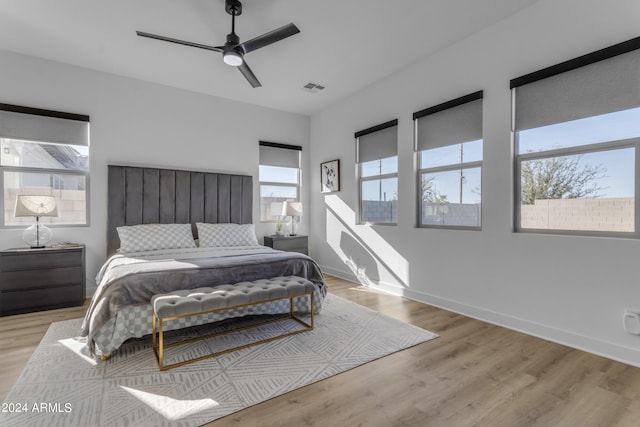 bedroom featuring light hardwood / wood-style flooring and ceiling fan