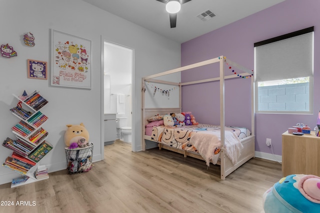 bedroom featuring connected bathroom, light hardwood / wood-style floors, and ceiling fan