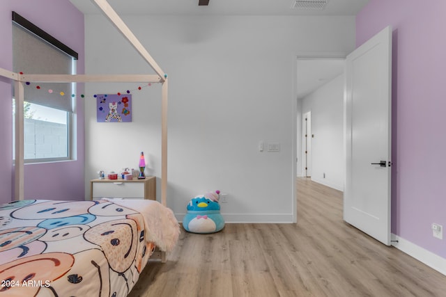 bedroom with light hardwood / wood-style floors