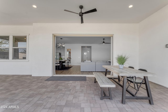 view of patio with ceiling fan and an outdoor hangout area