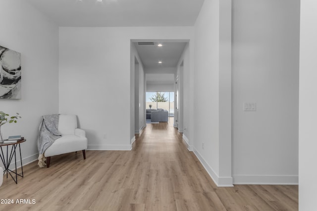 corridor featuring light hardwood / wood-style floors