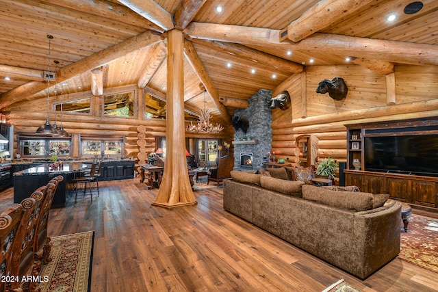 living room with rustic walls, plenty of natural light, wood ceiling, and wood-type flooring