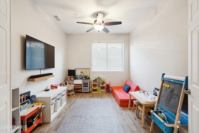 game room featuring ceiling fan and light hardwood / wood-style floors