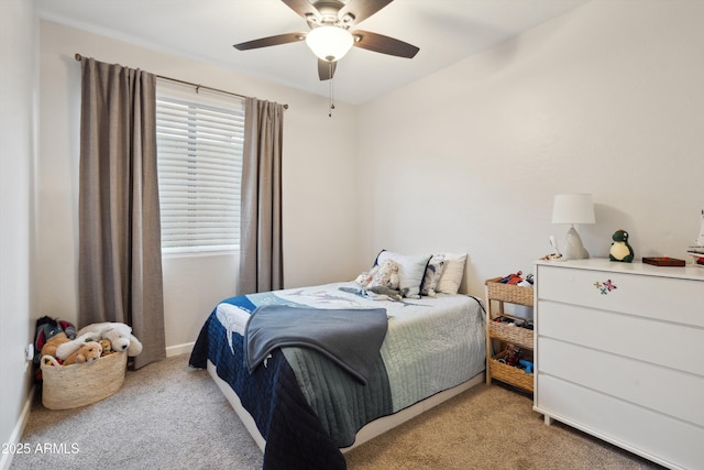 bedroom with light colored carpet and ceiling fan