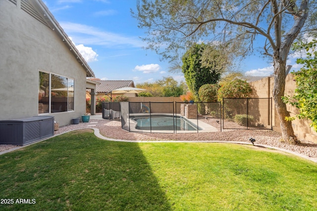 view of yard with a fenced in pool