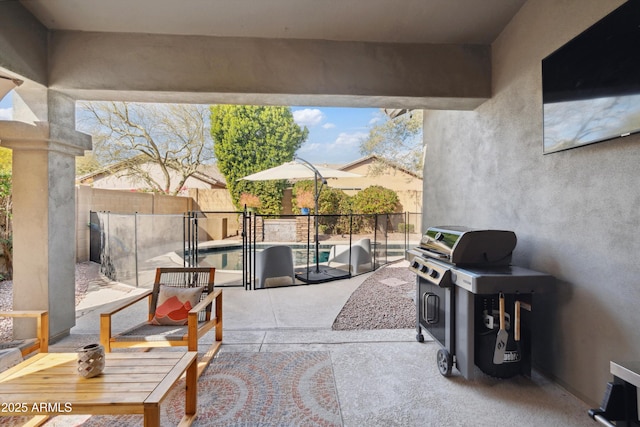 view of patio / terrace with a fenced in pool