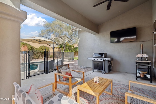 view of patio featuring area for grilling and a fenced in pool