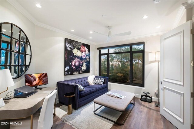 living room with ceiling fan, dark hardwood / wood-style flooring, and ornamental molding