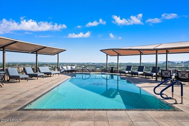 view of swimming pool with a patio