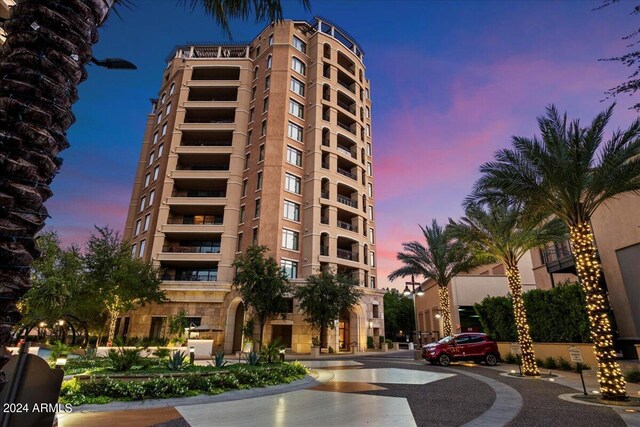 view of outdoor building at dusk