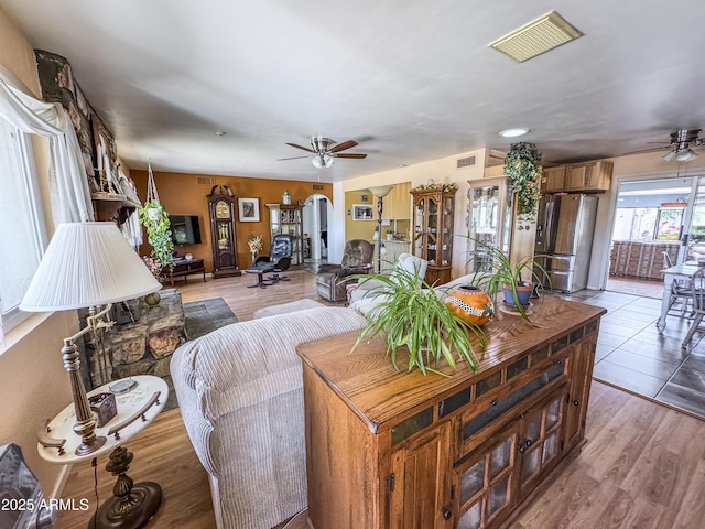 living area with a ceiling fan