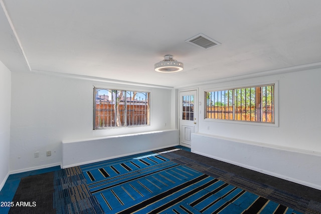 6040 N 31st Dr, Phoenix, AZ 85017 - spare room featuring baseboards