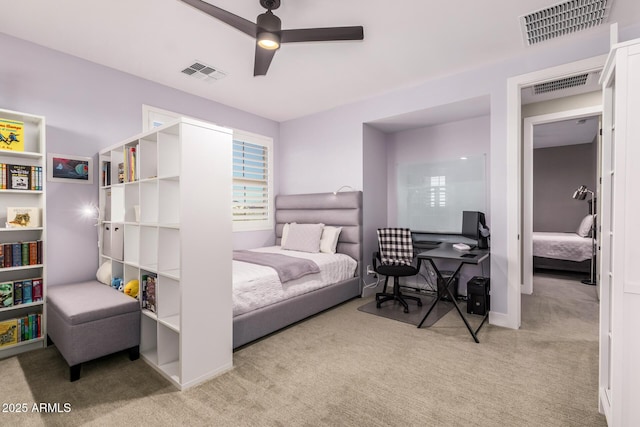 bedroom featuring light carpet and ceiling fan