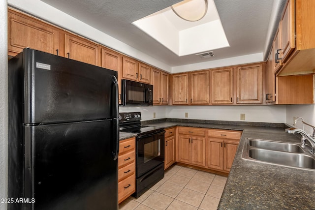 3434 E Baseline Rd Unit 216, Phoenix, AZ 85042 - kitchen with black appliances, a sink, light tile patterned floors, and dark countertops