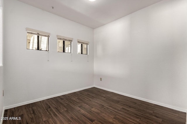 3434 E Baseline Rd Unit 216, Phoenix, AZ 85042 - spare room with dark wood-style flooring and baseboards
