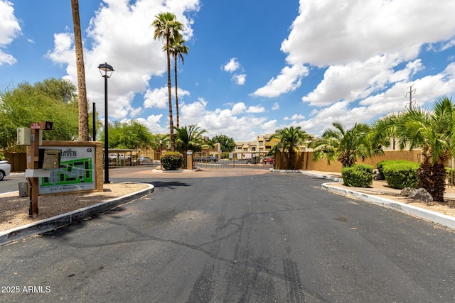 3434 E Baseline Rd Unit 216, Phoenix, AZ 85042 - view of asphalt road featuring curbs and street lights