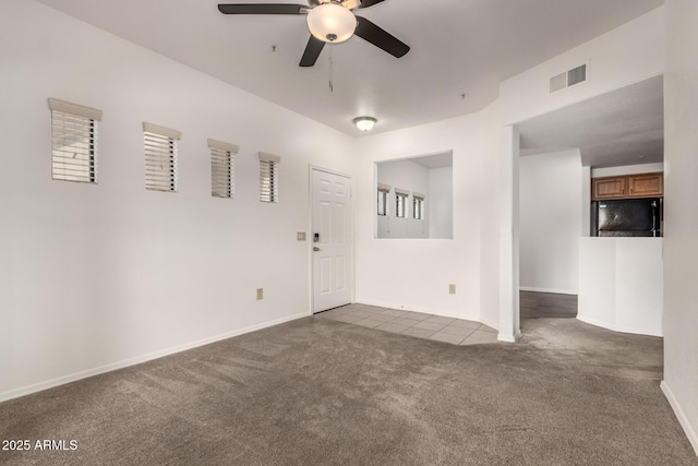 3434 E Baseline Rd Unit 216, Phoenix, AZ 85042 - spare room with dark carpet, ceiling fan, and baseboards