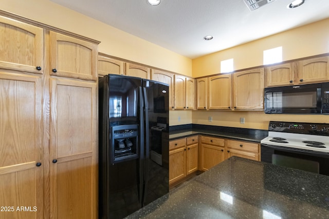 kitchen featuring black appliances and dark stone counters