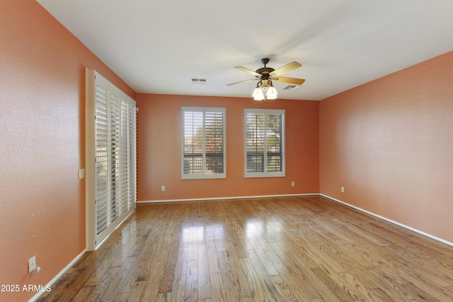 empty room featuring light hardwood / wood-style floors and ceiling fan