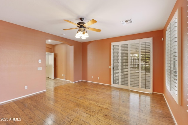 spare room with ceiling fan and light hardwood / wood-style floors